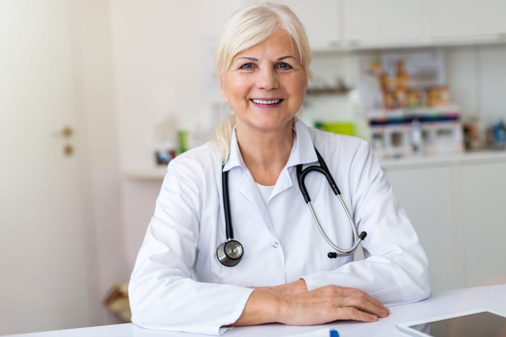 Senior female doctor smiling at the camera